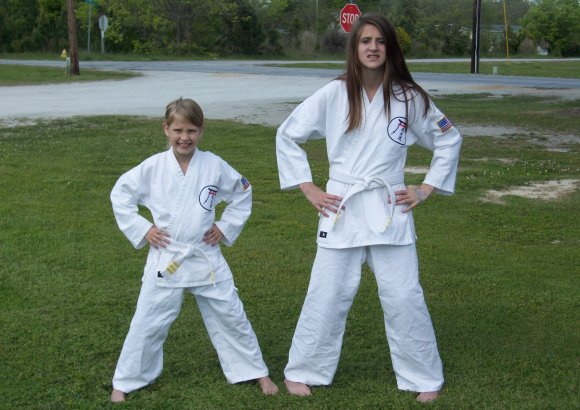 New Bern Sisters earn White Belt in Karate