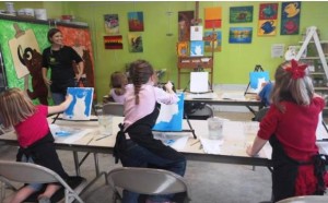 Lindsay Demonch teaches a painting class at Bear Hands Art Factory