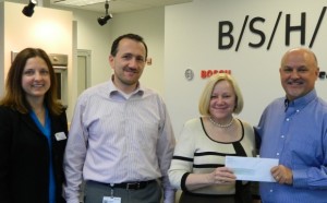 Lori, Worley, President, of Partners In Education; Frank Rebmann, Commercial Director and John Wilson, Human Resources Manager at the New Bern BSH facility along with Darlene Brown, Executive Director of PIE.