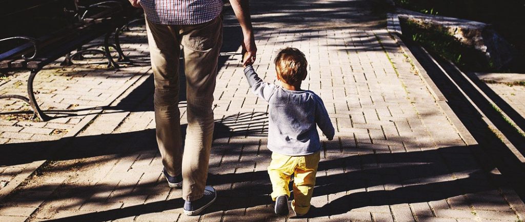 Child and Person holding hands