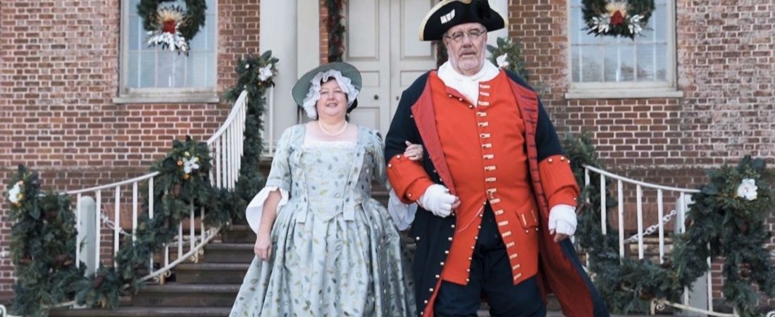 Man and woman in historic costumes at Tryon Palace