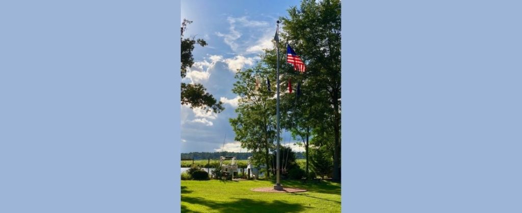 Photo of dock and flag pole at New Bern Yacht Club