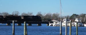 Norfolk Southern Railroad Train rides over Trent River Bridge in New Bern NC