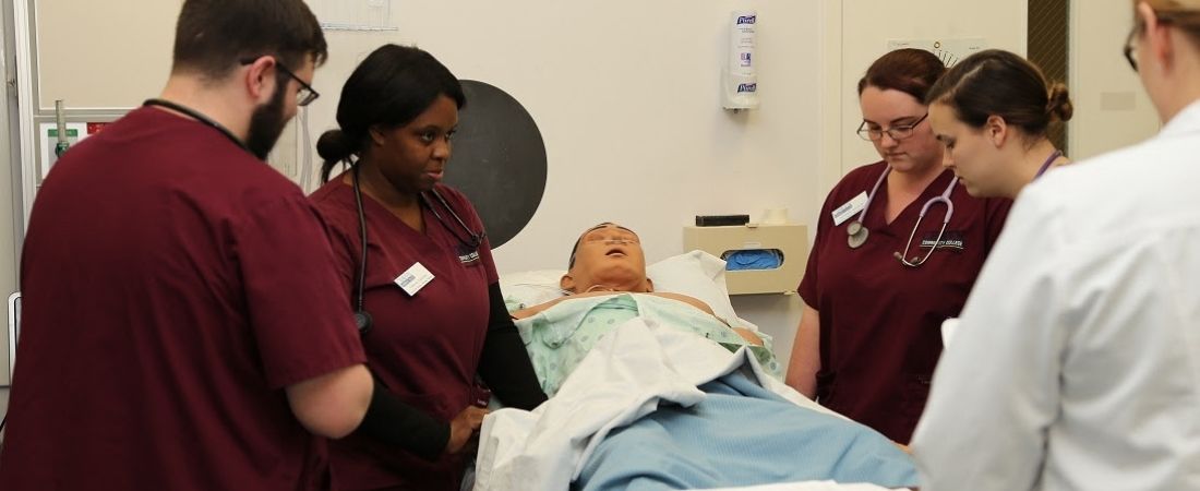 Nursing students with patient