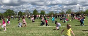 Kids in field looking for easter eggs