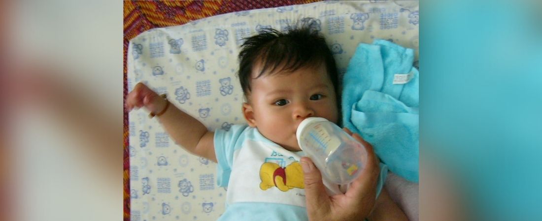 Infant with bottle