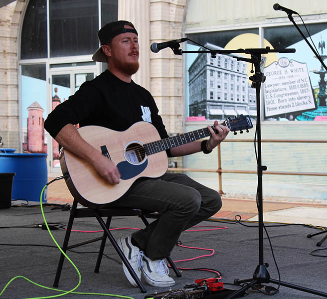 Musician Ryan Rubich performing at MumFeast in New Bern, NC