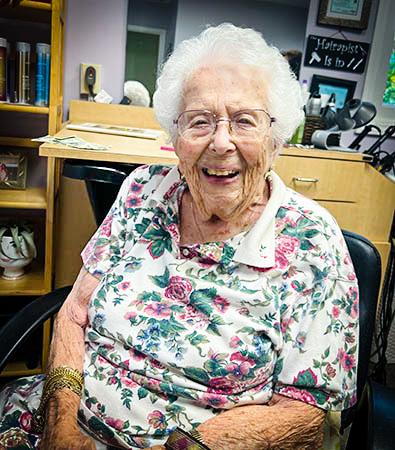 Joan Smith, just a couple of weeks before her 107th birthday, posed after getting her hair done by Kim Bennett during her final regular Friday visit to Harbor Hair Designs.