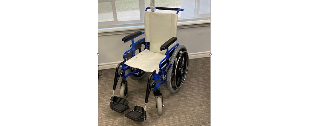 Wheelchair outfitted to traverse Tryon Palace grounds