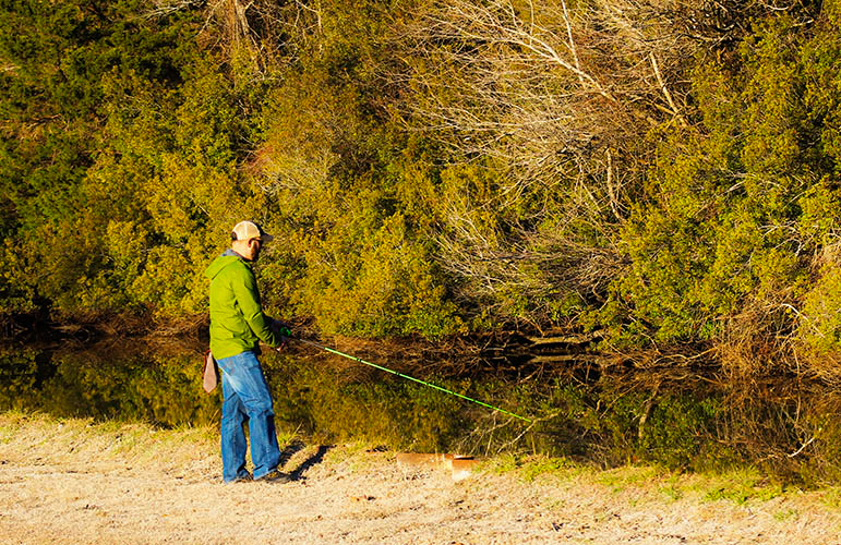 Chris Green fishing at Martin Marietta Park in New Bern, NC. Photo by Wendy Card.