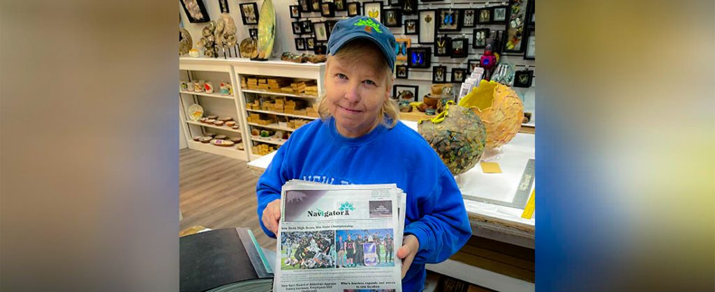 Wendy Card delivering the Navigator Newspaper in New Bern, NC.