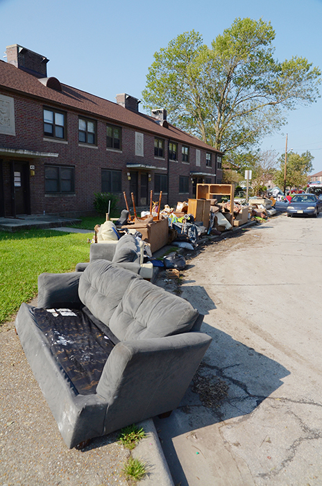 A line of flood-damaged furniture and other items are piled on the sidewalk at Trent Court in Sept. 2018. Photo by Todd Wetherington