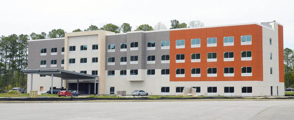 The opening of the new Holiday Inn Express & Suites going up behind the New Bern Mall has been pushed back once again to at least October 2023. 