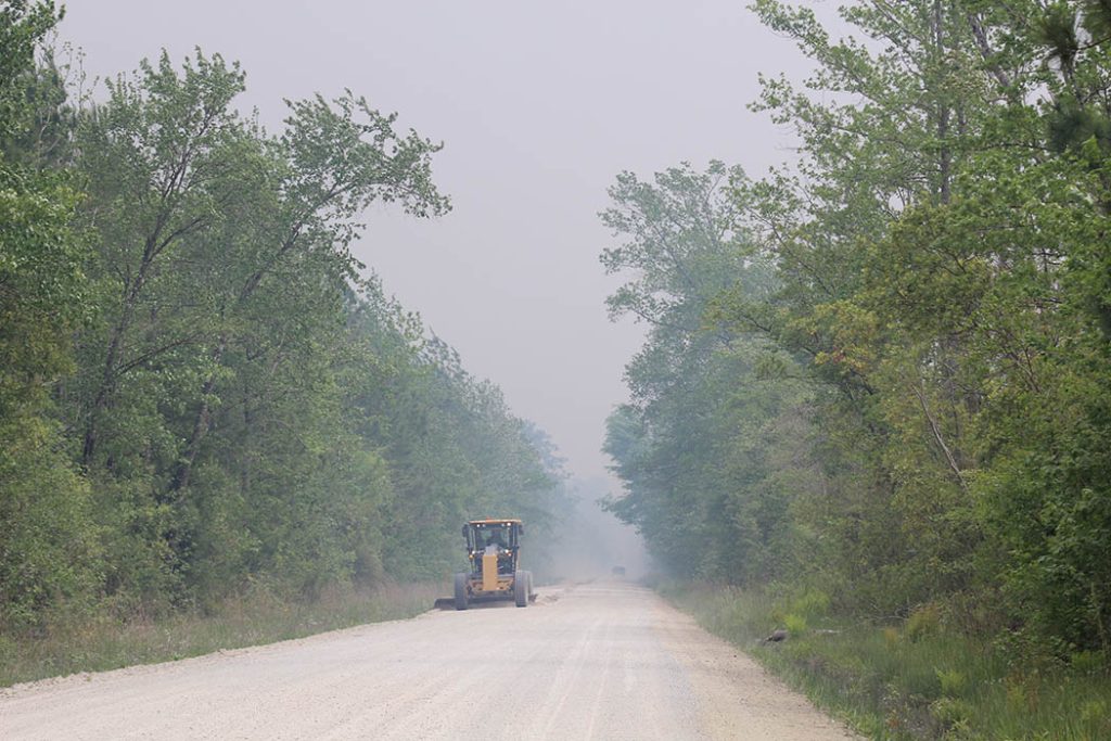 Worker on Countyline Road in the Croatan National Forest. Photo by Wendy Card.