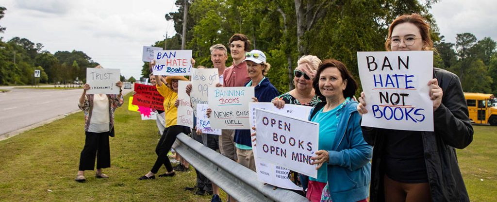 People protest book bans in front of Grover C. Fields. Photo by Matt McCotter.