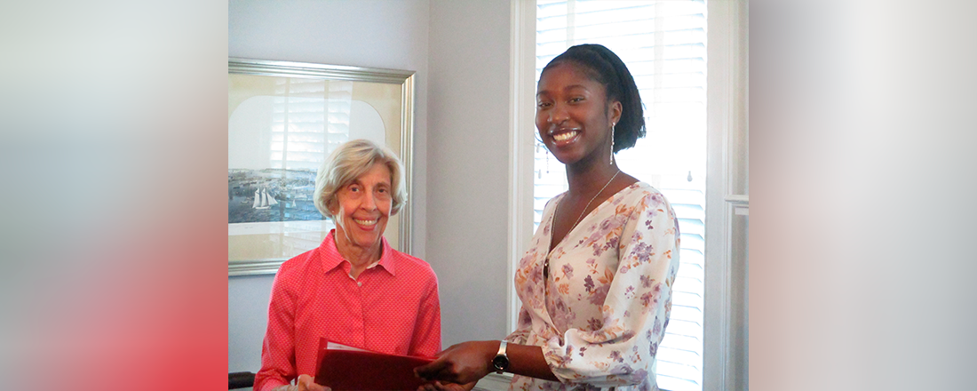 Kadiatou Diawara accepts her certificate from Scholarship Committee Chair, Mary Parrish Kadiatou Diawara accepts her certificate from Scholarship Committee Chair, Mary Parrish
