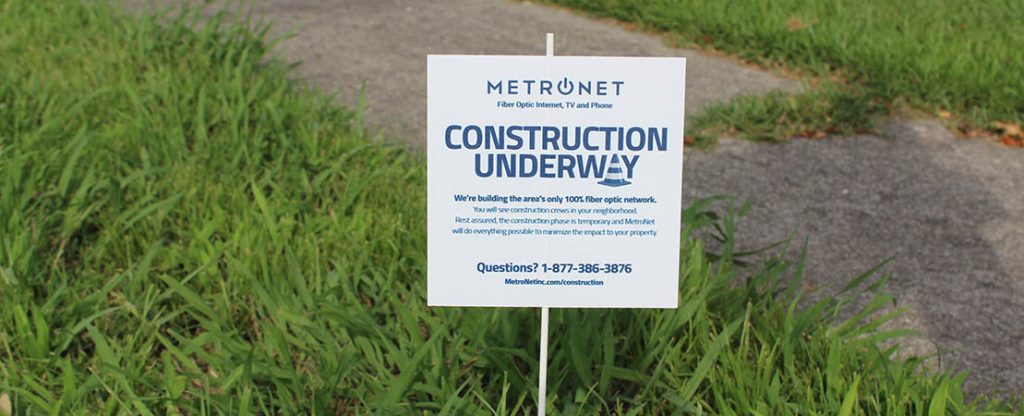 Metronet sign in yard.