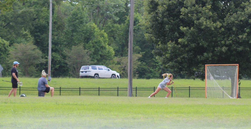 Practicing lacrosse at Lawson Creek Park.