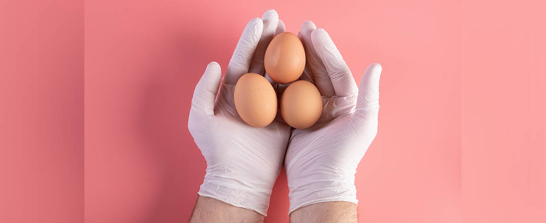 "Hand with white medical latex gloves holding egss. Easter and COVID-19 Pandemic concept" by focusonmore.com is licensed under CC BY 2.0.