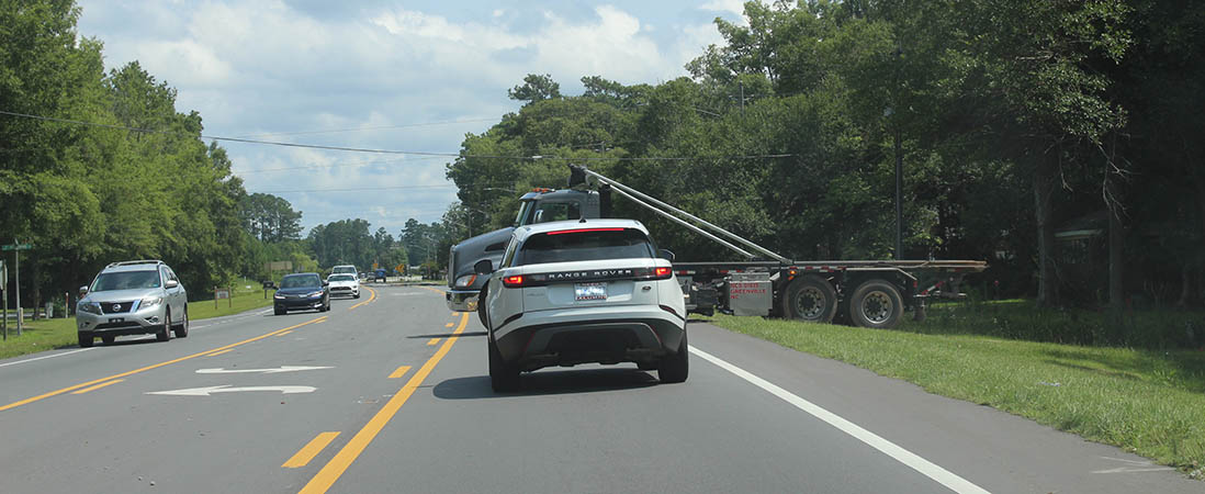 Truck backs into driveway from highway in New Bern, N.C.