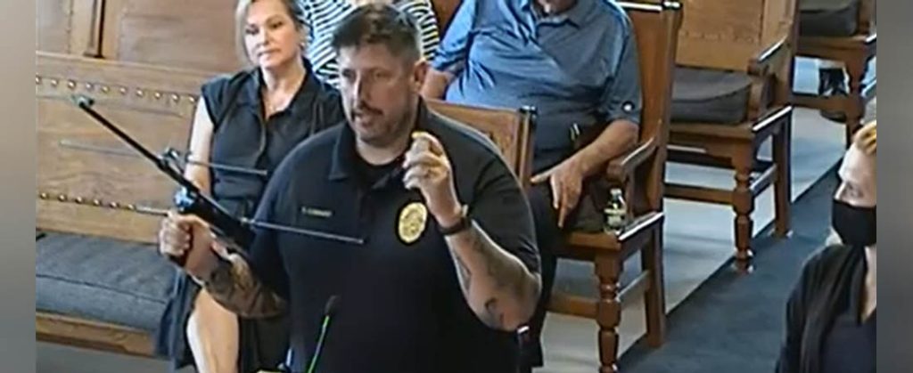 Police Lieutenant Todd Conway explains how a transmitter is used to locate individuals enrolled in the Project Lifesaver program. (Screenshot of Board of Alderman meeting)
