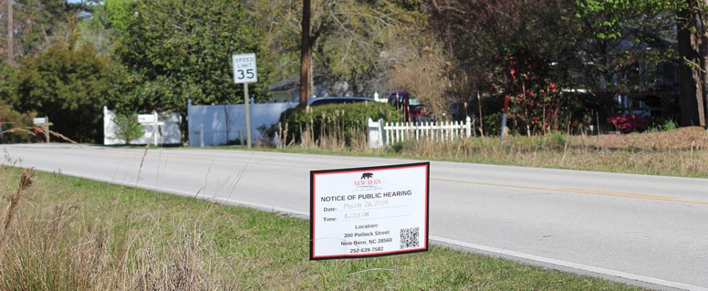 Notice of public hearing on the side of West Thurman Road in New Bern, NC. (NBN Photo)