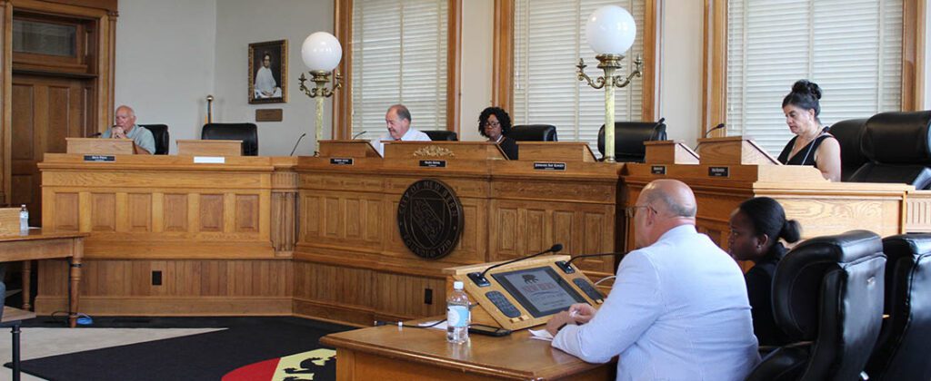 Photo of New Bern Board of Aldermen meeting on July 23, 2024. From left to right: Alderman Rick Prill and Bobby Aster, Mayor Pro Tem Hazel Royal and Alderman Barbara Best with City Manager Foster Hughes and Asst. City Attorney Jaimee Mosely. (Photo by Wendy Card)