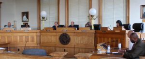 Alderman Rick Prill of Ward 1, Alderman Hazel Royal of Ward 2, Alderman Bobby Aster of Ward 3, Mayor Jeffrey Odham, Alderman Johnnie Ray Kinsey of Ward 4 and Alderman Barbara Best of Ward 5 in the courtroom at City Hall in downtown New Bern taken on Aug. 2, 2024. (Photo by Wendy Card)