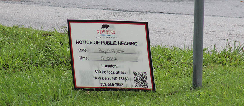 Notice of public hearing sign posted next to Washington Post Road in New Bern, NC in early August 2024 still stands on Nov. 11. (Photo by Wendy Card)