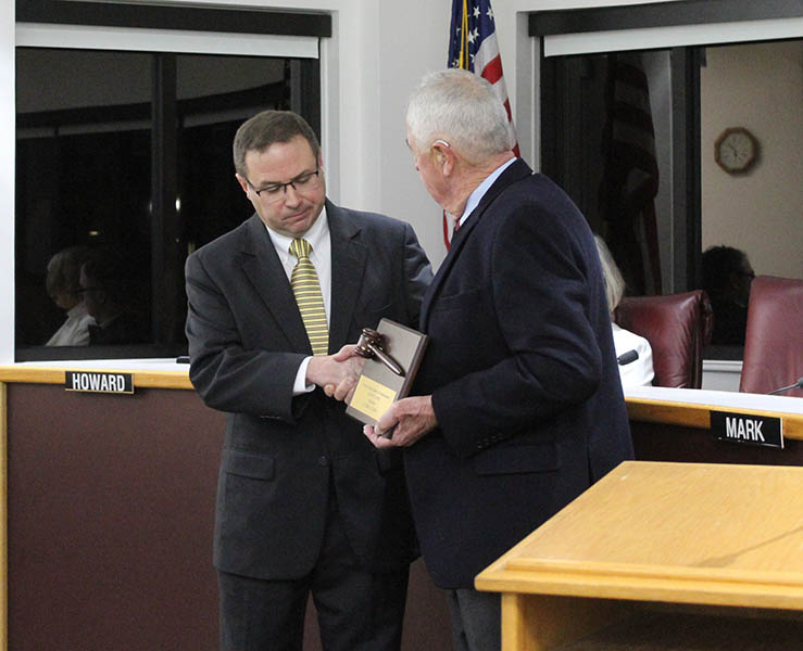 Commissioner Jason Jones recognized for serving four years as chairman of the Board of Commissioners by new Chairman Denny Bucher (Photo by Wendy Card)