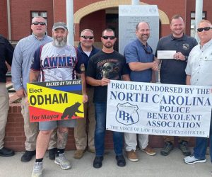 Alderman Odham with New Bern Police Officers in front of Police Station