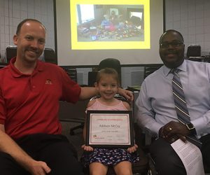 Award presentation to Addison McCoy
