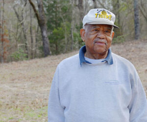 Jones County native Sam Barber stands near the site of his family's graveyard in Trenton that dates back to the late 19th century. Barber is working to get the plot cleaned up and recognized with a memorial marker.