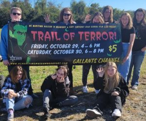 Group holding Boo-fort sign