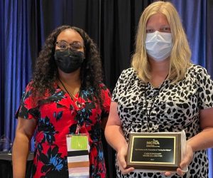 Two CarolinaEast Nurses holding award plaque