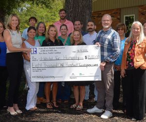 Brittany Blizzard, NRRAR president, presents HFHCC Board President Chip Payson with a check for a Matching Grant on Wednesday, September 9. Also pictured are: Marie Phillipsn; Kristi Diello; Whitney Woodall, NRRAR Association Executive; Meredith Morse; Debi Edwards, Neuse River Region Multiple Listing Service President; Billie Jo Stewart; Johnny Harrison; Lillian Horne; Annmarie Conta; Josh Reason, HBA President; Michael Raines; Austin Bayliss; Rosemarie Doshier, NC Housing Foundation; Lori Neill, HBA executive Officer; and Tracey Lilly, HFHCC Executive director.