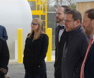 Craven County Commissioners Beatrice Smith, Chadwick Howard and Jason Jones, join County Manager Jack Veit and Lauren Wargo, assistant to the county manager, during the ribbon cutting ceremony for the county's new fueling station.