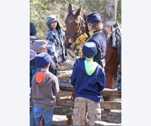 Cavalary with children at enactment camp