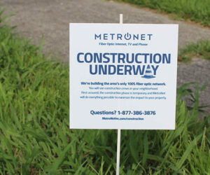 Metronet sign in yard.