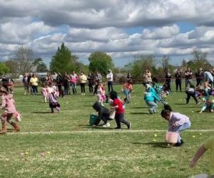 Kids in field looking for easter eggs