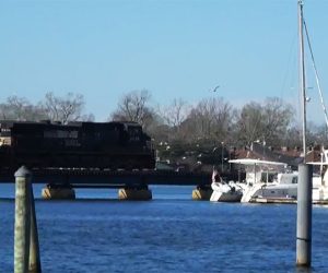 Norfolk Southern Railroad Train rides over Trent River Bridge in New Bern NC