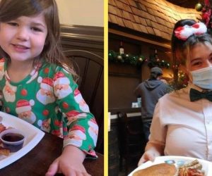 Young girl smiling eating pancakes and waitress by Christmas tree