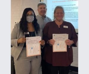 Dr. Roneca Wallace, principal at Graham A. Barden Elementary, and Debra Hurst, principal at W.J. Gurganus Elementary receiving their awarding from PIE past president, Don Brinkley