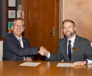 Craven CC President Dr. Ray Staats, left, and NC Wesleyan University President Dr. Evan D. Duff sign a new agreement that provides discounted tuition rates for Craven CC employees.