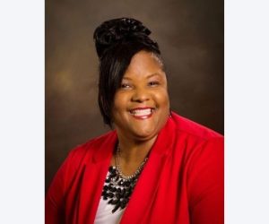 Simone Gardner wearing red jacket